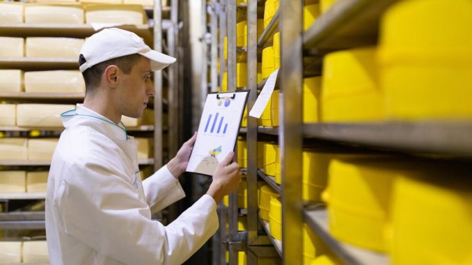 technologist-white-robe-holding-graphs-statistics-stands-near-shelves-with-cheeses-production-cheese-products-racks-with-cheeses_645730-490 TRAINING ACCURATE INVENTORY PLANNING & STOCK CONTROL