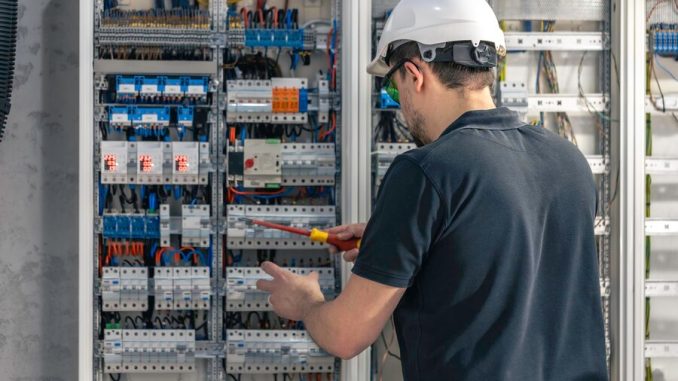 male-electrician-works-switchboard-using-electrical-connection-cable_169016-53666 TRAINING ELECTRICAL EQUIPMENT SYSTEM AND MAINTENANCE